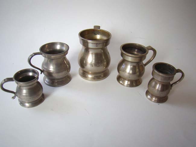 A collection of five antique English pewter tavern measures circa 1850-1900